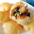 Chaat, like the pani puri pictured here, is where it's at.