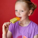 Helen Liles eating one her mom's creations.