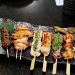 SIZZLE STICKS: Grilled skewers of meat make up the heart of Gaku's menu. Photograph by Zach Davenport