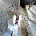 UPWARD BOUND: The new climbing wall at Touchstone takes advantage of the old movie theater's high ceiling.