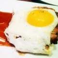 EXTRA TREAT: LB Steak's maple-glazed pork belly is topped with a fried egg.