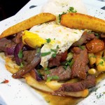 PERUVIAN WITH A TWIST: Lomo Saltado a lo Zenon features fried eggs and plantains.