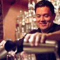 Bartender Eric Nielsen pours a cocktail at 55 South.