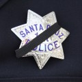 Officers wore a black band over their badges Thursday in honor of two Santa Cruz police officers, Loran Baker and Officer Elizabeth Butler, who were killed in the line of duty. (Photo by Matt Crawford)