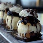 More Than Puff Pieces: Profiteroles are much like cream puffs, but at Dolce Bella Chocolate Cafe, they are elevated by homemade chocolate sauce, vanilla bean ice cream and puff pastry that has a crunchy edge. Photo by Kristine Bautista.