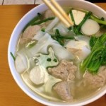 Burma on a plate: Burmese chicken noodle soup, an inviting broth with green mustard, chives, quail egg, tofu, and more. [Image gleaned from Yelp]