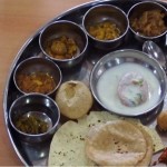 A thali is a traditional large, steel serving tray used to present a number of katori, small cookery bowls.