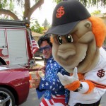 Elvis impersonator Rick Torres and the San Jose Giants' Gigante get ready to hit the road at a previous year's parade. Photo courtesy Rose, White & Blue Parade