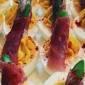 Deviled egg topped with prosciutto-wrapped roasted asparagus for SP2's happy hour.