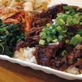 BOXING OUT: Fast and fresh Korean food hits downtown San Jose as Hom offers dishes like braised short ribs. Photograph by Stephen Layton