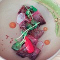 WAGYU THE DOG: Smeared sauces help accentuate most dishes, like Wagyu skirt steak, at Bird Dog.