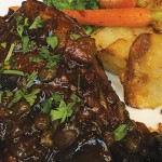 Élyse’s classic Coq au Vin delights the taste buds. Photo by André Jaquez