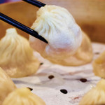 STUFFED: The crispy bottoms of the Famous Dumpling House’s pan-fried dumplings have a tasty snap. Photo by John Dyke